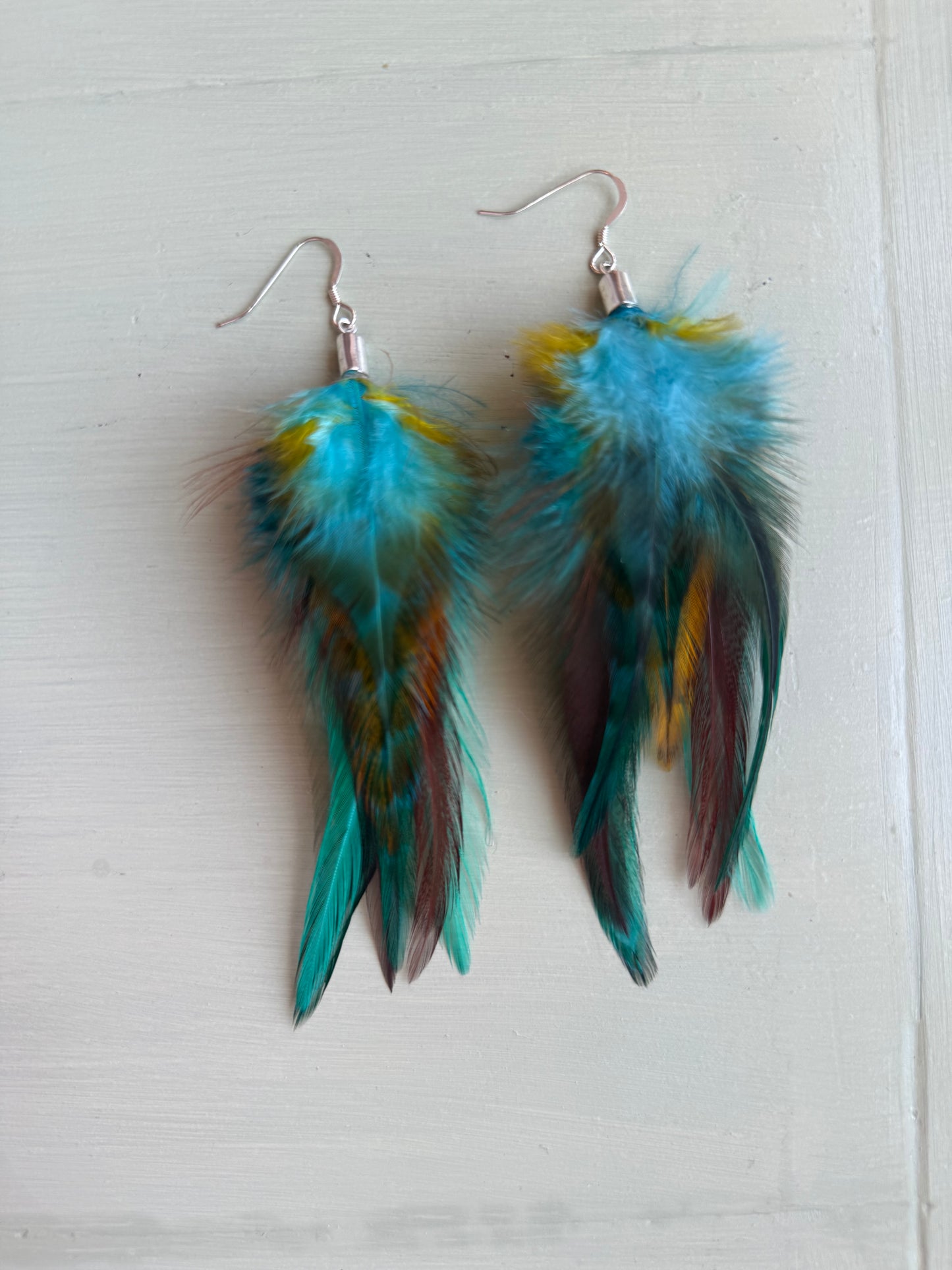 Fjäderörhängen korta