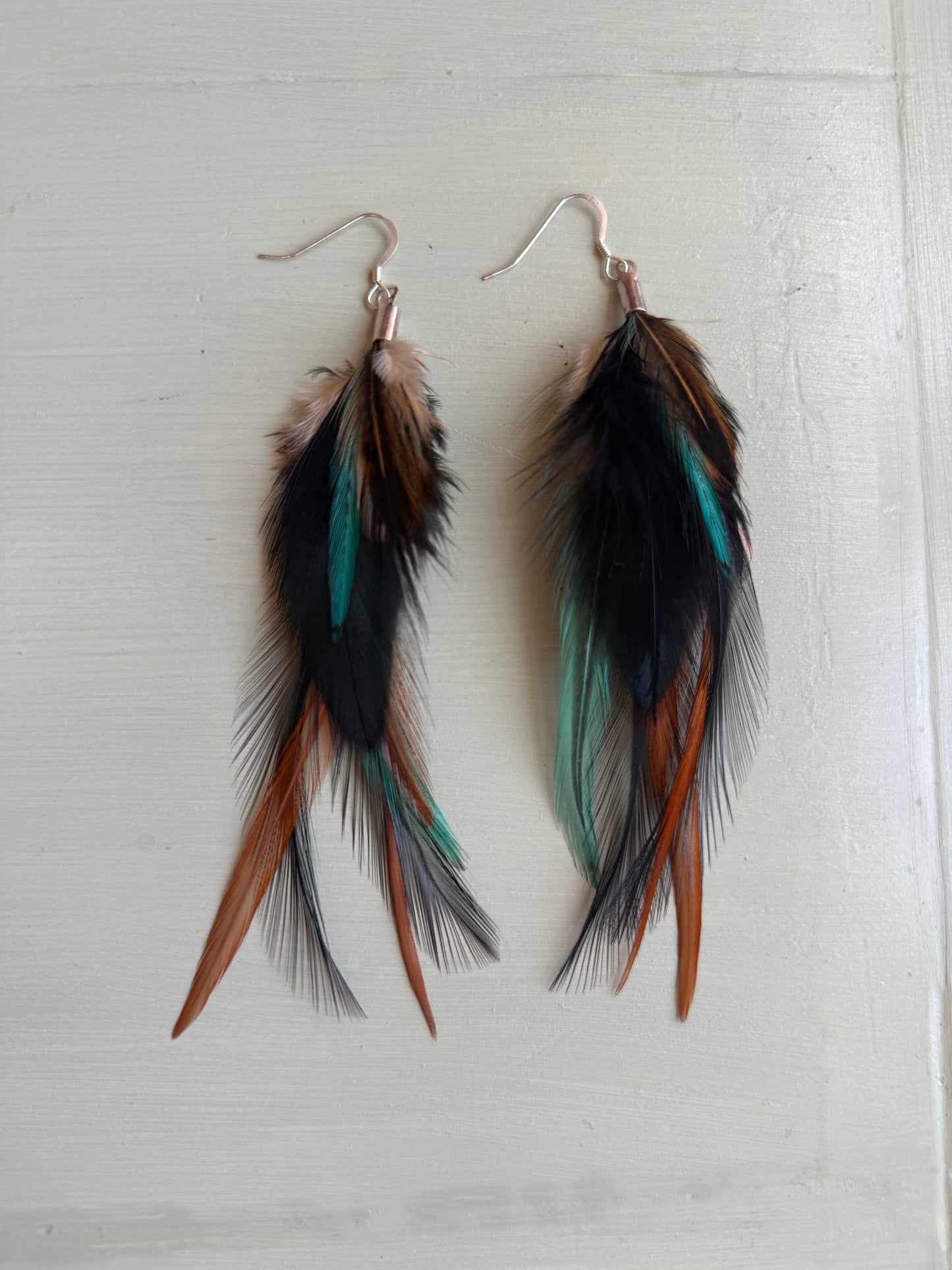 Fjäderörhängen korta